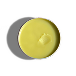 Top view of Urb Apothecary Repair Salve in tin with smooth golden balm — herbal formula crafted to repair cracked skin, soothe irritation, and promote healing
