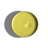 Top view of Urb Apothecary Repair Salve in tin with smooth golden balm — herbal formula crafted to repair cracked skin, soothe irritation, and promote healing