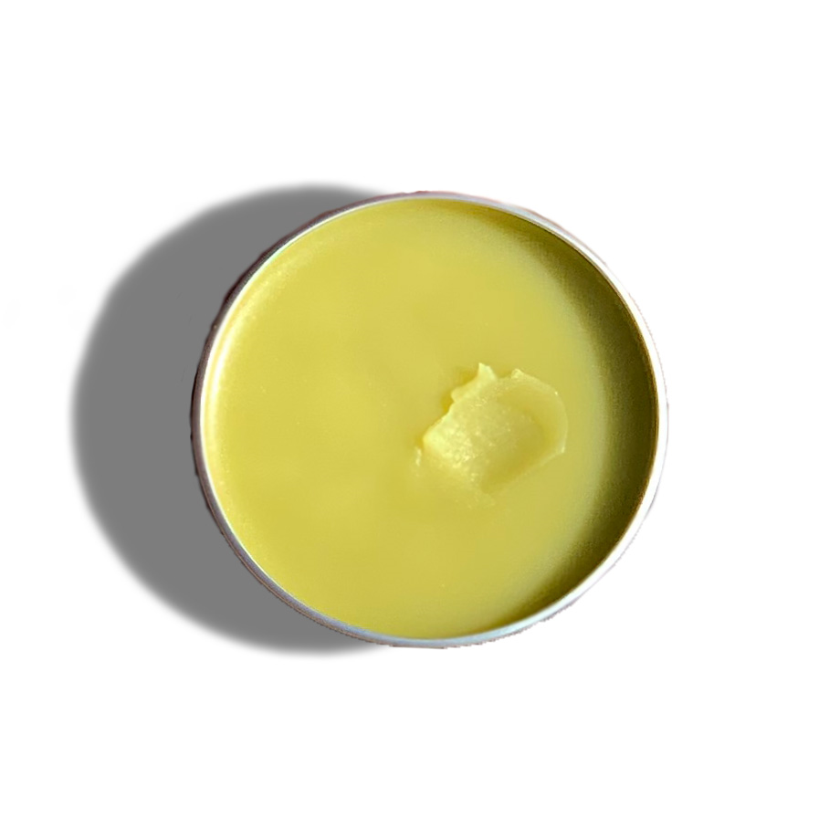 Top view of Urb Apothecary Repair Salve in tin with smooth golden balm — herbal formula crafted to repair cracked skin, soothe irritation, and promote healing
