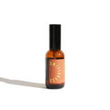 Amber glass bottle of Urb Apothecary Sweetgrass Hydrosol, distilled from organic sweetgrass in the Pacific Northwest. This natural facial toner helps reduce redness, soothe acne, prep skin for serums, and clear negative energy with a soft scent of vanilla and fresh-cut hay.