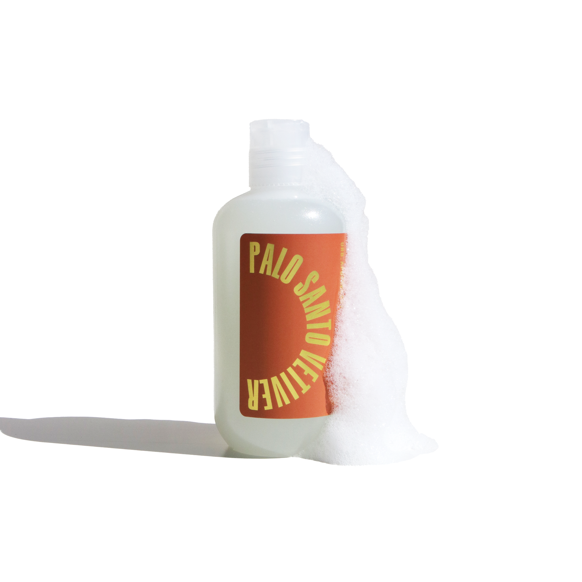 Minimalist image of Palo Santo Cleanser by Urb Apothecary, in a translucent bottle with bold graphic label and foamy bubbles for a fresh, clean aesthetic