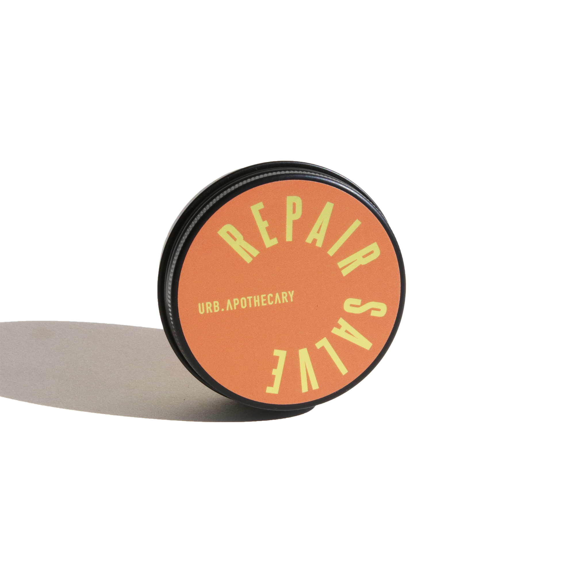 Urb Apothecary Repair Salve tin with bold orange label — all-purpose herbal balm for healing cracked skin, cuts, rashes, and post-tattoo care